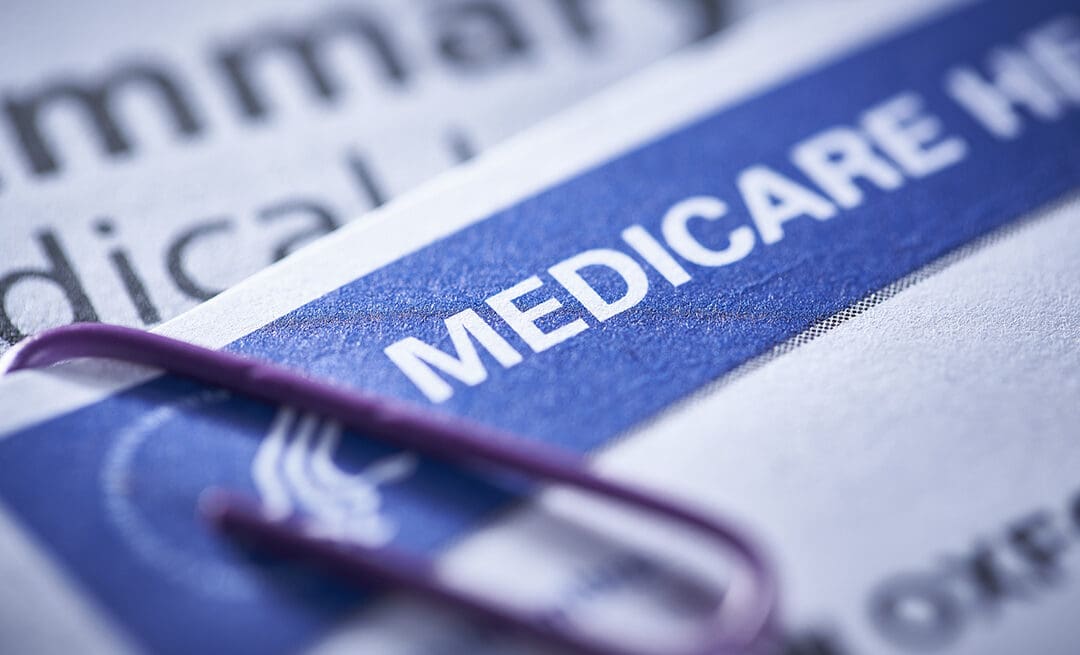 Medicare health insurance card with a paperclip